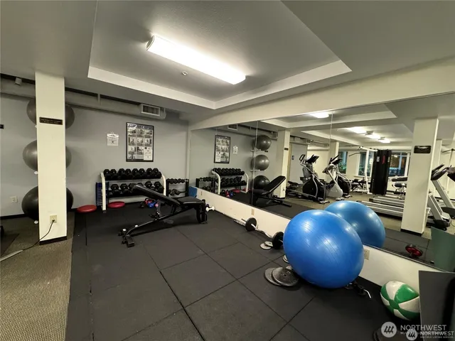a view of a patio with a dining table and chairs under an umbrella