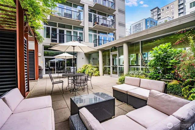 a large kitchen with a table and chairs