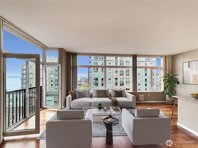 a living room with furniture and a large window