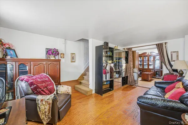 a bedroom with furniture and a large window