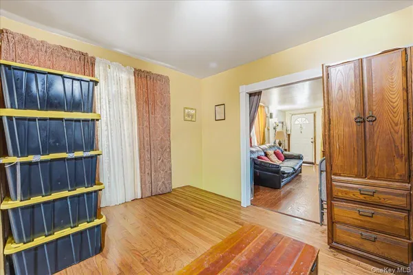 a bedroom with a bed and a book shelf