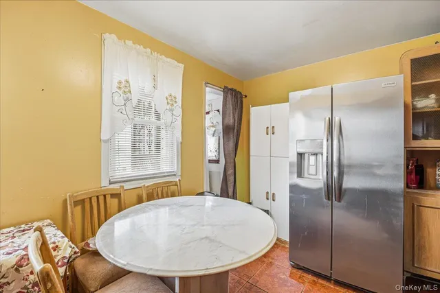 a bathroom with a granite countertop sink and a large mirror
