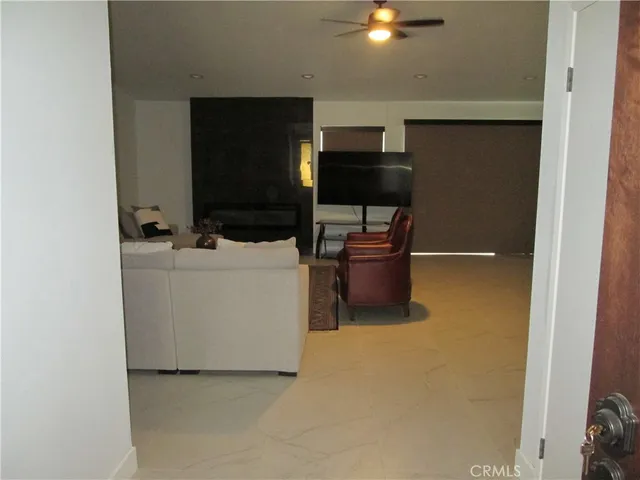 a living room with a couch and a rug