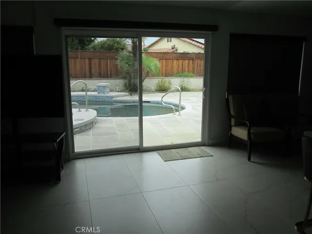 a living room with a couch and a rug