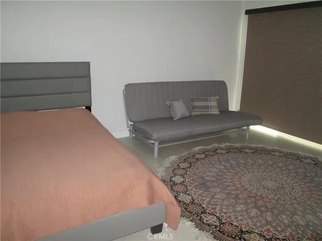 a kitchen with a sink and chairs