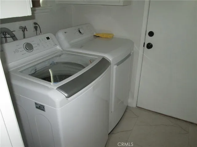 a living room with a couch and a rug