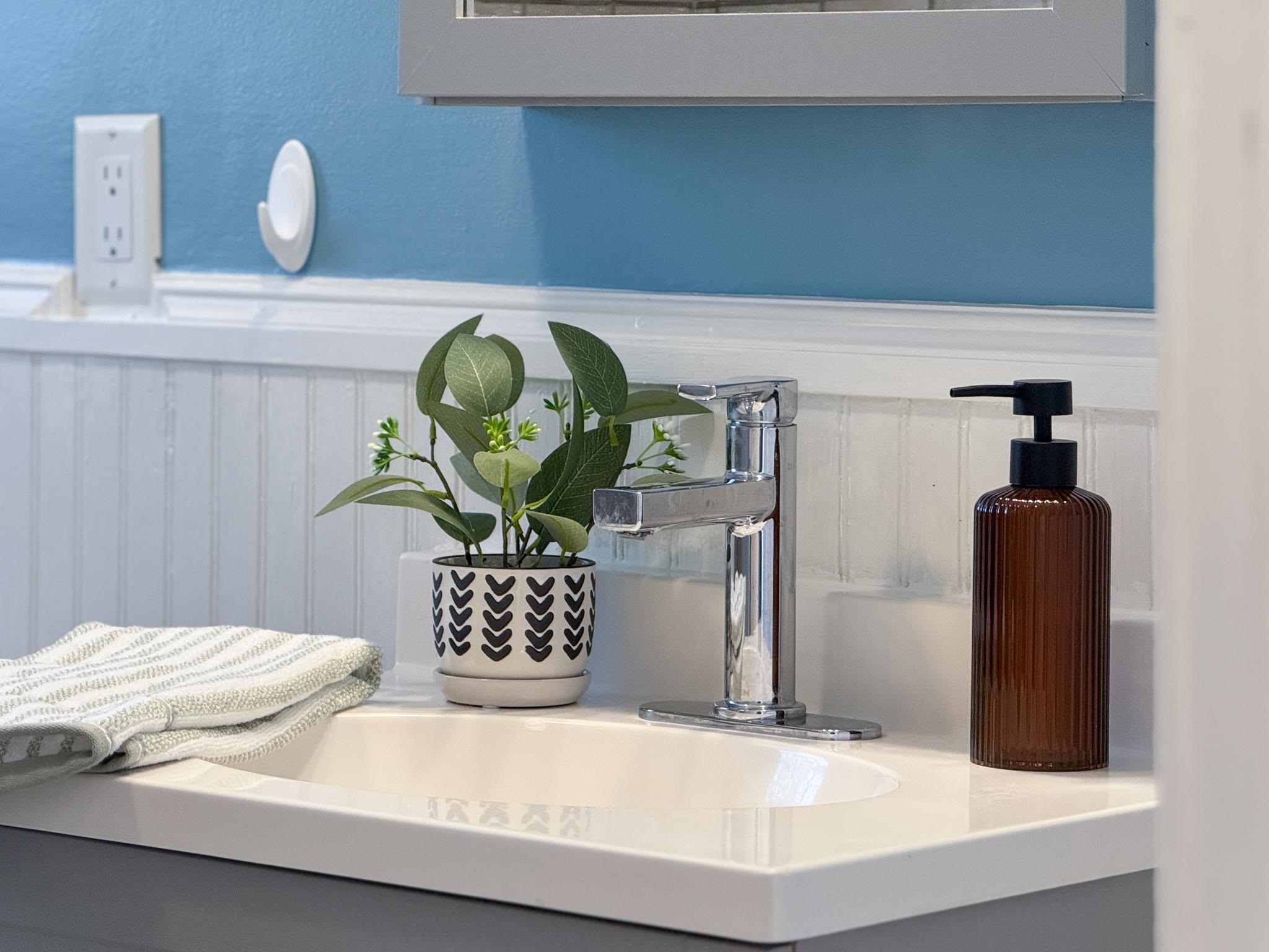 703 Monroe Street Staunton, VA 24401 - Photo 19 of 21 a bathroom with a sink and a mirror