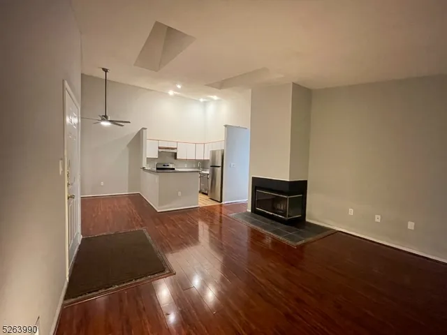 a kitchen with stainless steel appliances a refrigerator and a stove top oven