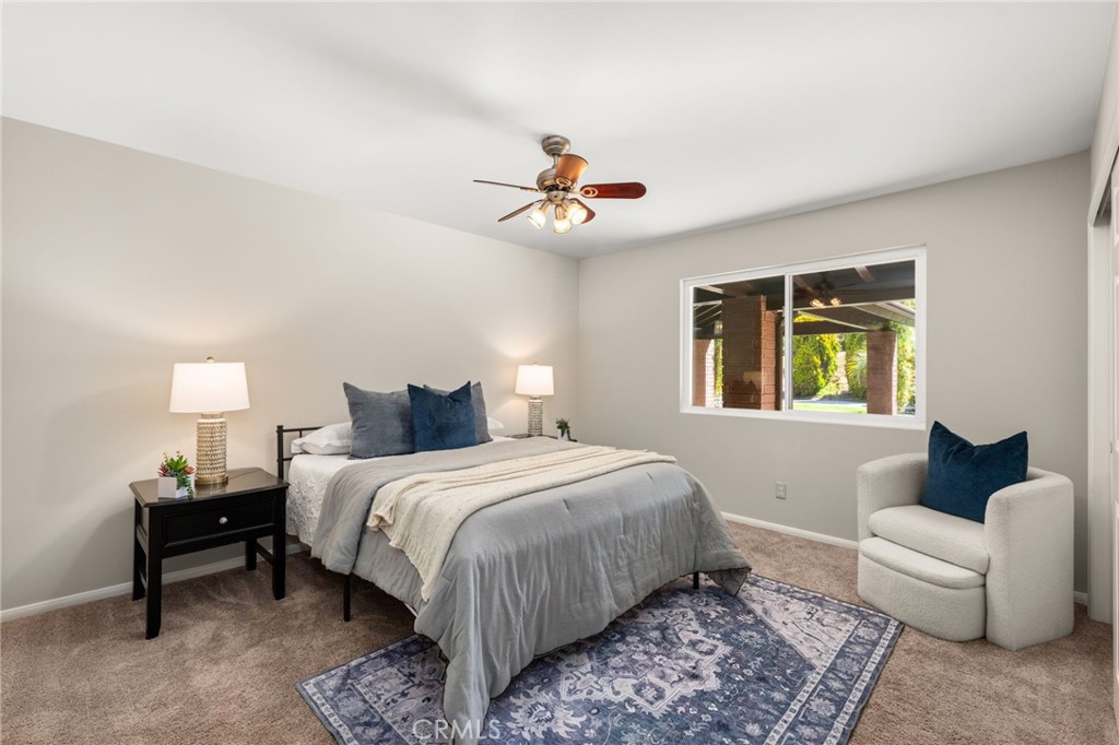2465 Via Oeste Drive Fallbrook, CA 92028 - Photo 25 of 44 a bedroom with bed and a couch