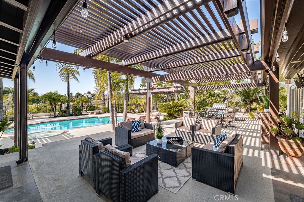 2465 Via Oeste Drive Fallbrook, CA 92028 - Photo 27 of 44 a outdoor living space with patio furniture and garden view