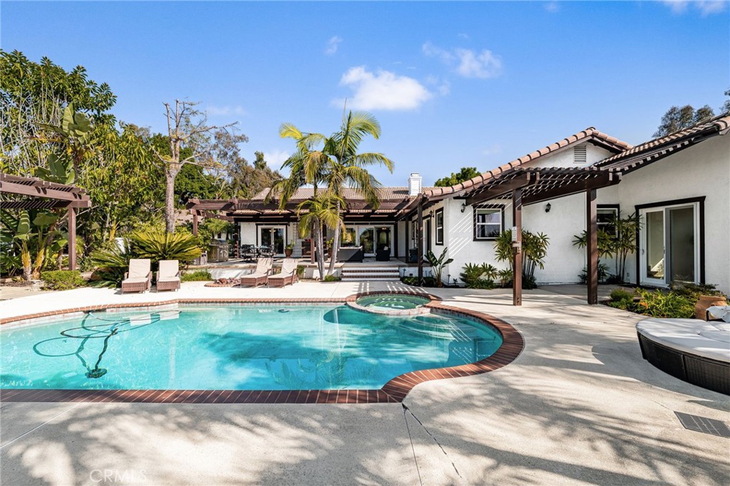 2465 Via Oeste Drive Fallbrook, CA 92028 - Photo 32 of 44 a view of a house with swimming pool and sitting area