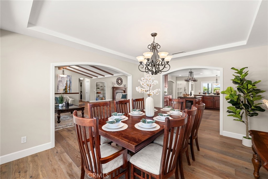 2465 Via Oeste Drive Fallbrook, CA 92028 - Photo 7 of 44 a view of a dining room with furniture and chandelier
