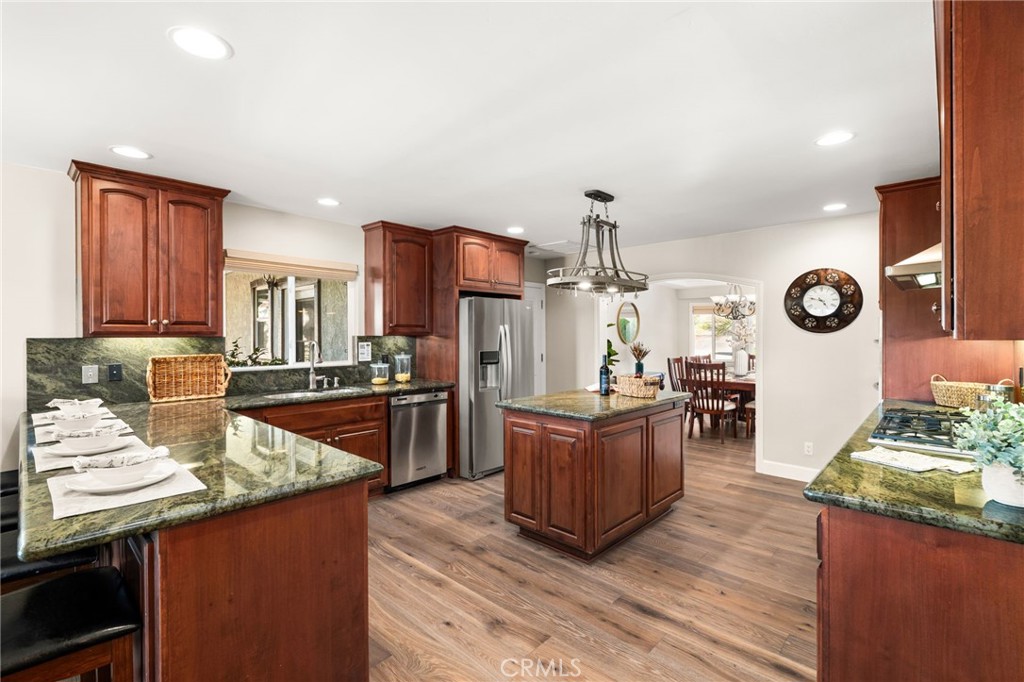 2465 Via Oeste Drive Fallbrook, CA 92028 - Photo 9 of 44 a kitchen with stainless steel appliances granite countertop a sink stove and refrigerator
