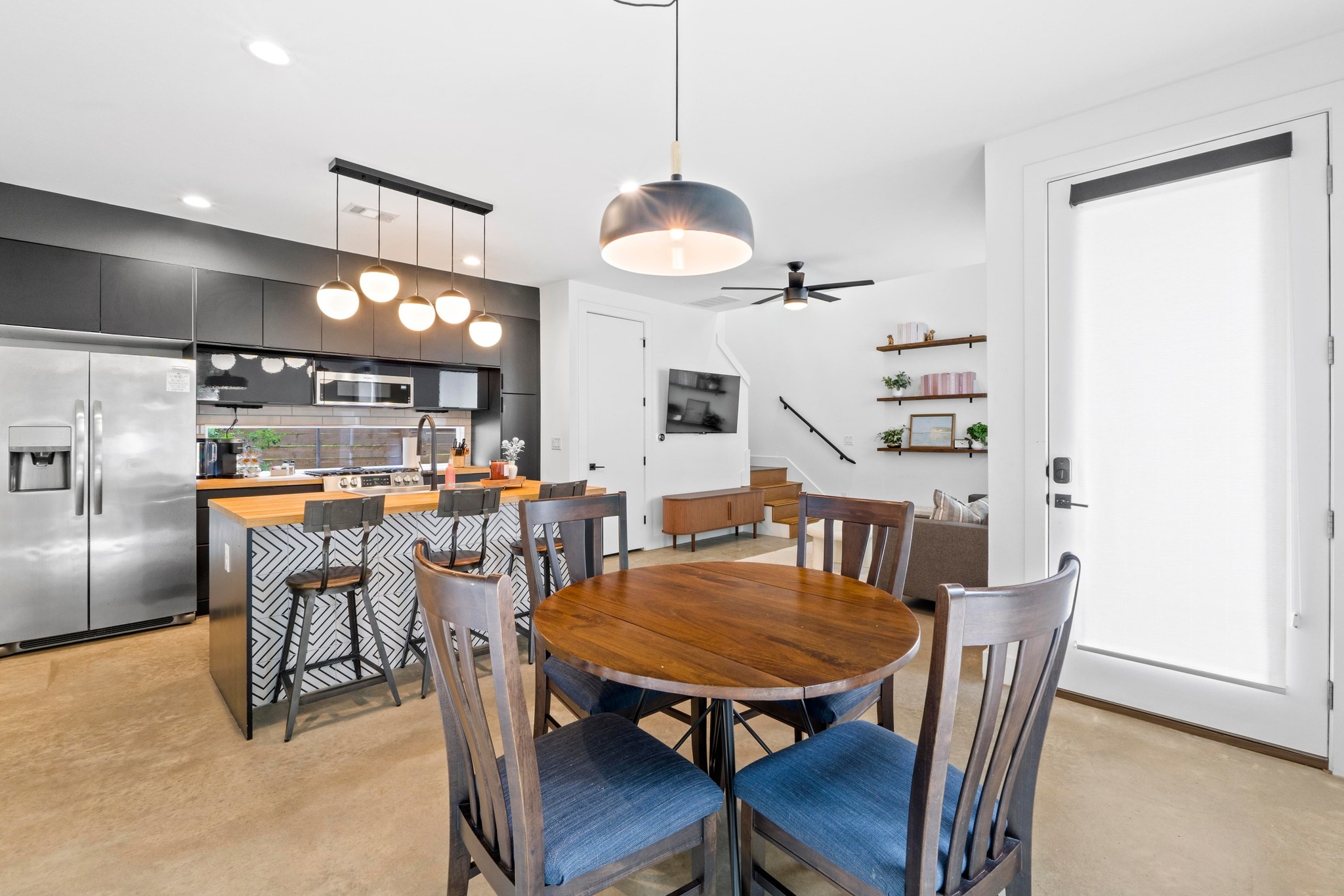 1706 Perez Street, Unit 2 Austin, TX 78721 - Photo 3 of 29 An open-concept living space integrates a modern kitchen and dining area.