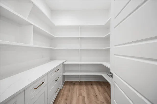 a storage room with wooden floor