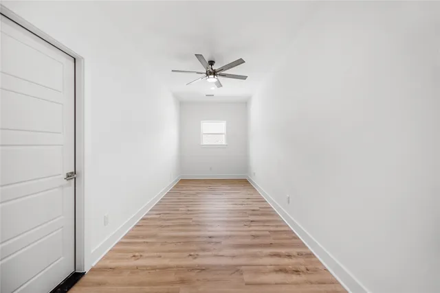 a spacious bathroom with a double vanity sink a mirror and a