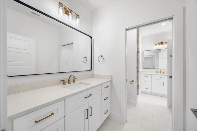 an empty room with wooden floor and window