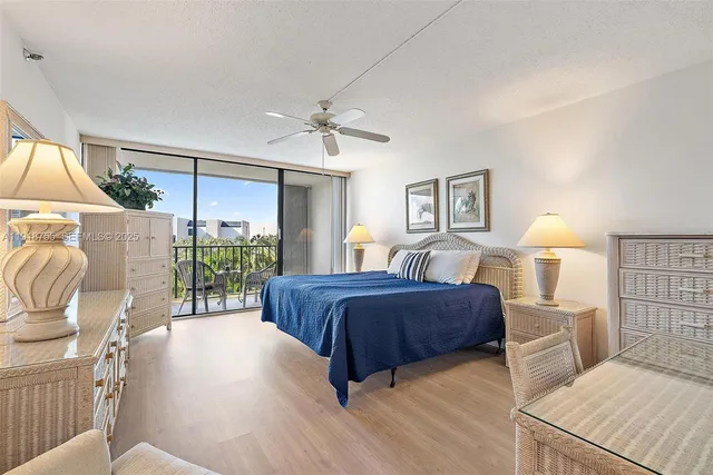 a bedroom with a bed window and couch