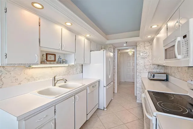 a bathroom with a sink double vanity and a mirror