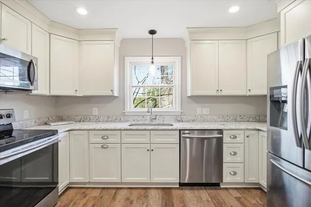 a view of a room with a large window