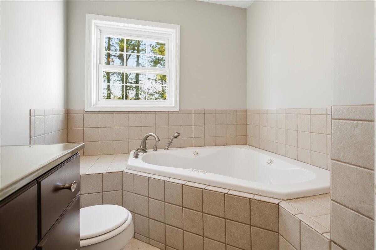 2127-2129 Moneta Road Bedford, VA 24523 - Photo 19 of 66 a bathroom with a sink a toilet and window