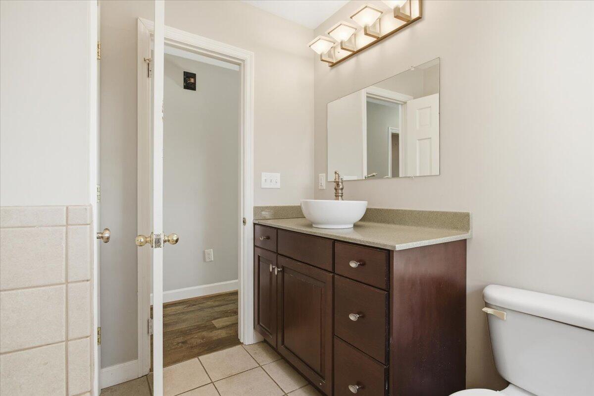 2127-2129 Moneta Road Bedford, VA 24523 - Photo 20 of 66 a bathroom with a sink vanity and a mirror