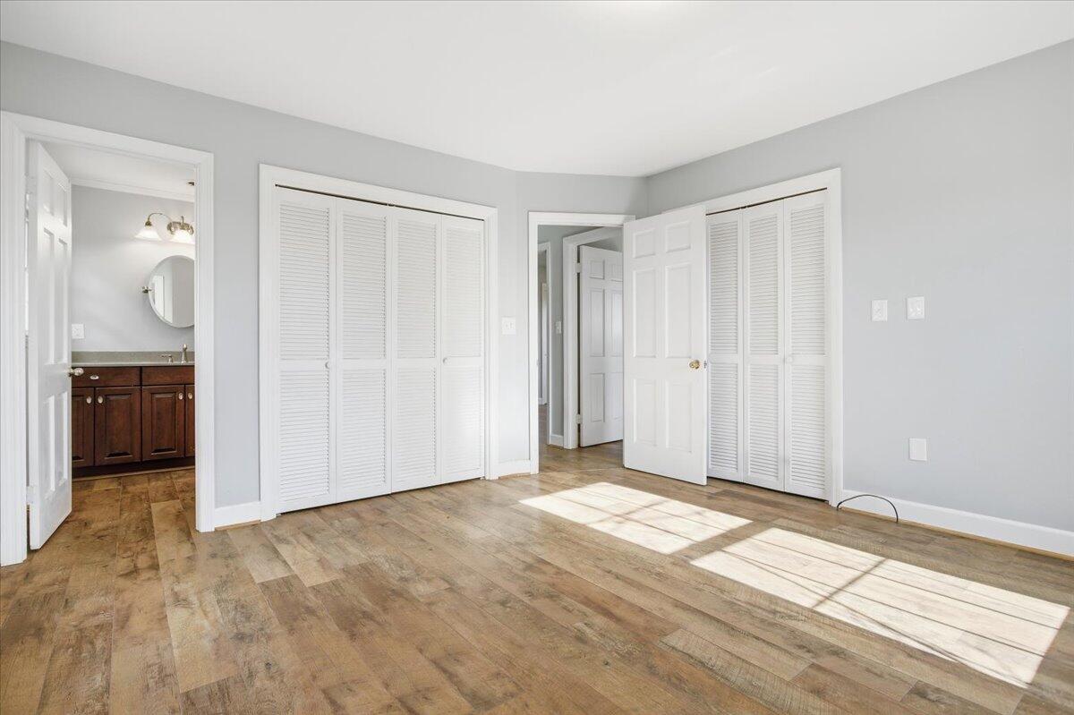 2127-2129 Moneta Road Bedford, VA 24523 - Photo 25 of 66 a view of a livingroom with wooden floor and a bathroom
