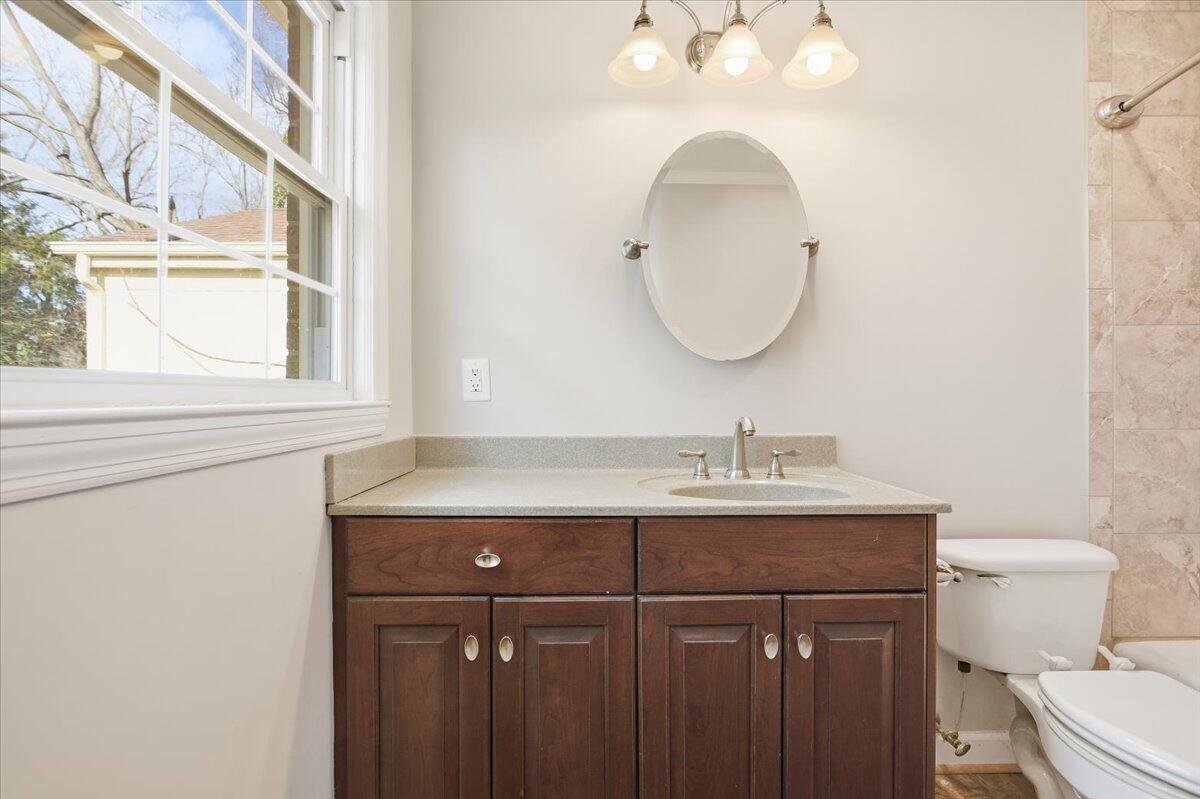 2127-2129 Moneta Road Bedford, VA 24523 - Photo 26 of 66 a bathroom with a toilet a sink and a mirror