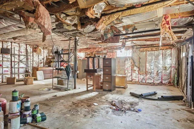 a room has a bed and a window