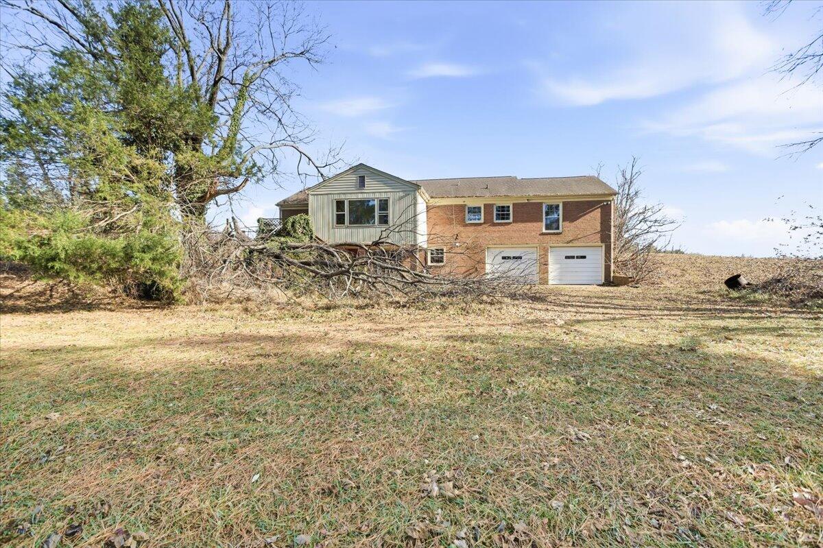 2127-2129 Moneta Road Bedford, VA 24523 - Photo 34 of 66 a front view of a house with a yard