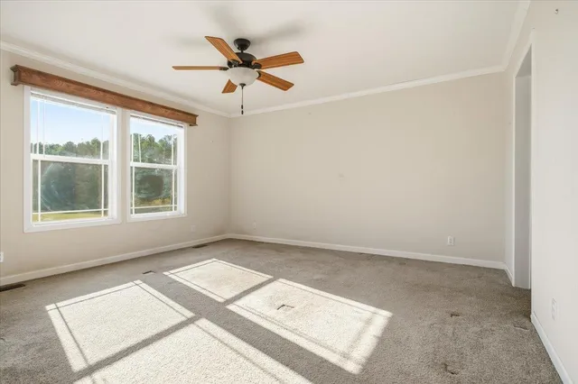 an empty room with closet and a bathroom