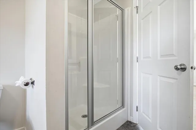 a living room with furniture a fireplace and a window