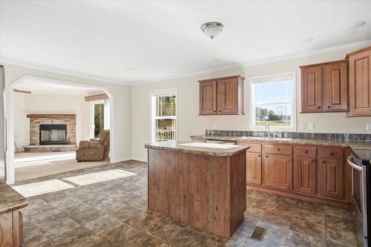 2127-2129 Moneta Road Bedford, VA 24523 - Photo 46 of 66 a kitchen with granite countertop a sink and cabinets