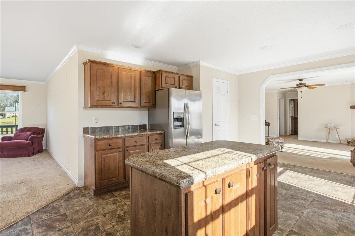 2127-2129 Moneta Road Bedford, VA 24523 - Photo 47 of 66 a kitchen with kitchen island granite countertop a stove and a refrigerator