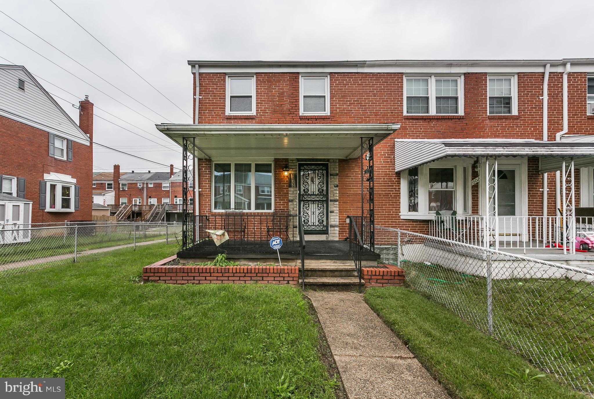 1000 Arncliffe Road Baltimore, MD 21221 - Photo 2 of 36 a view of a brick house with a yard porch and sitting area