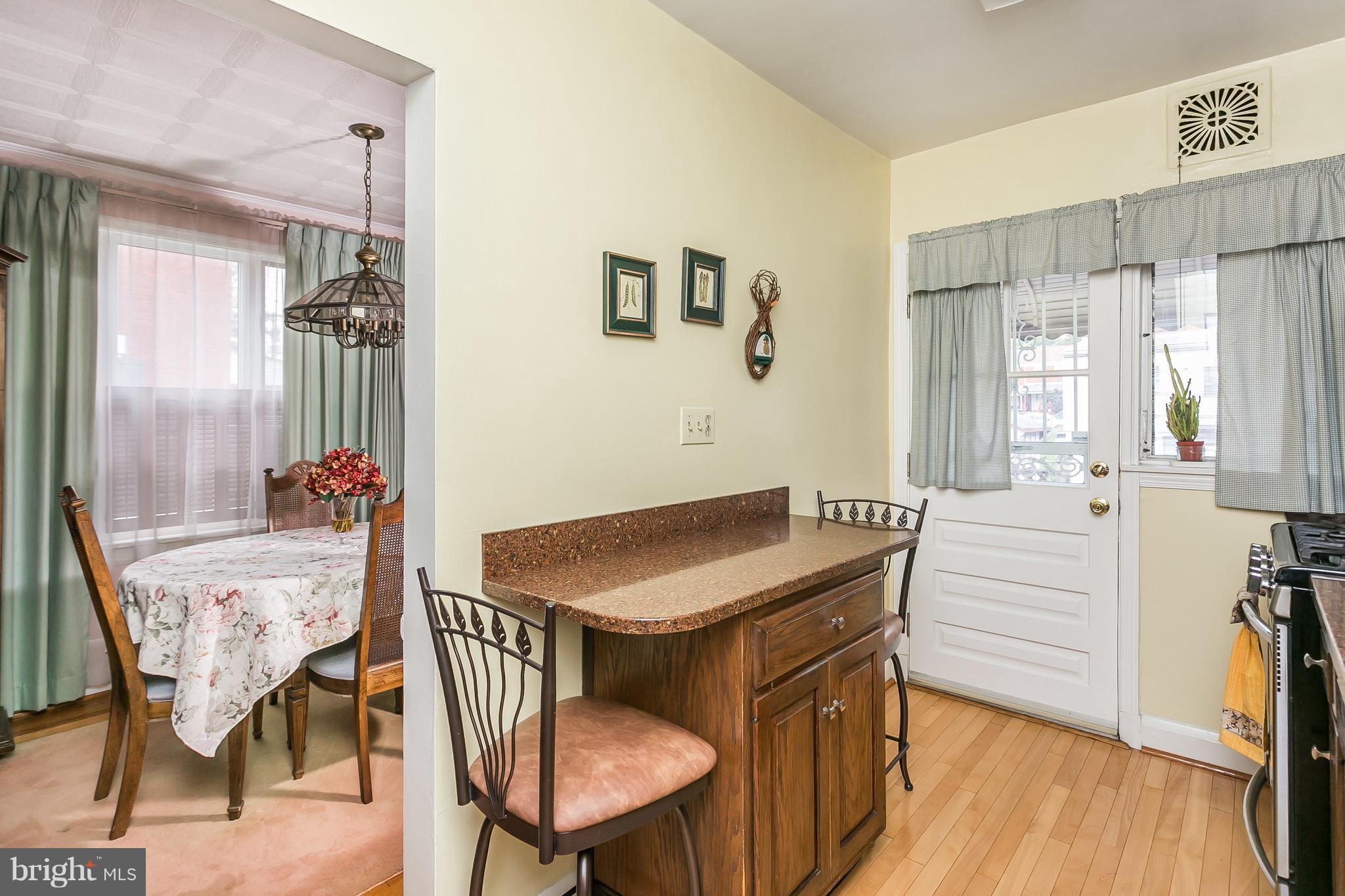 1000 Arncliffe Road Baltimore, MD 21221 - Photo 13 of 36 a dining room with furniture and wooden floor