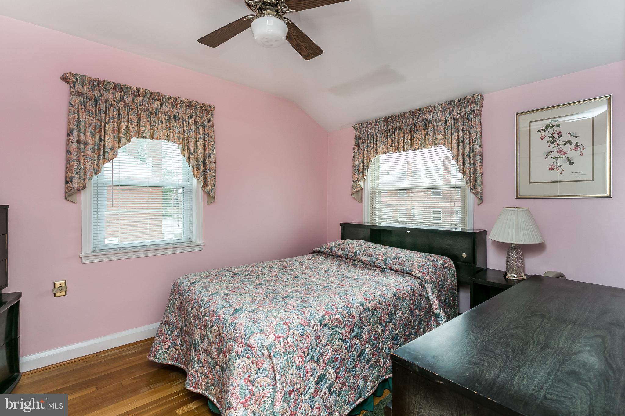 1000 Arncliffe Road Baltimore, MD 21221 - Photo 16 of 36 a bedroom with two beds and a window