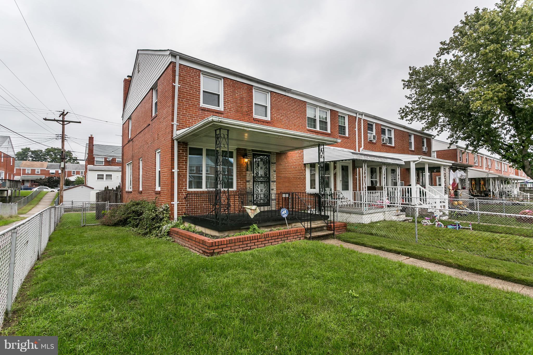 1000 Arncliffe Road Baltimore, MD 21221 - Photo 3 of 36 a front view of a house with a yard table and chairs