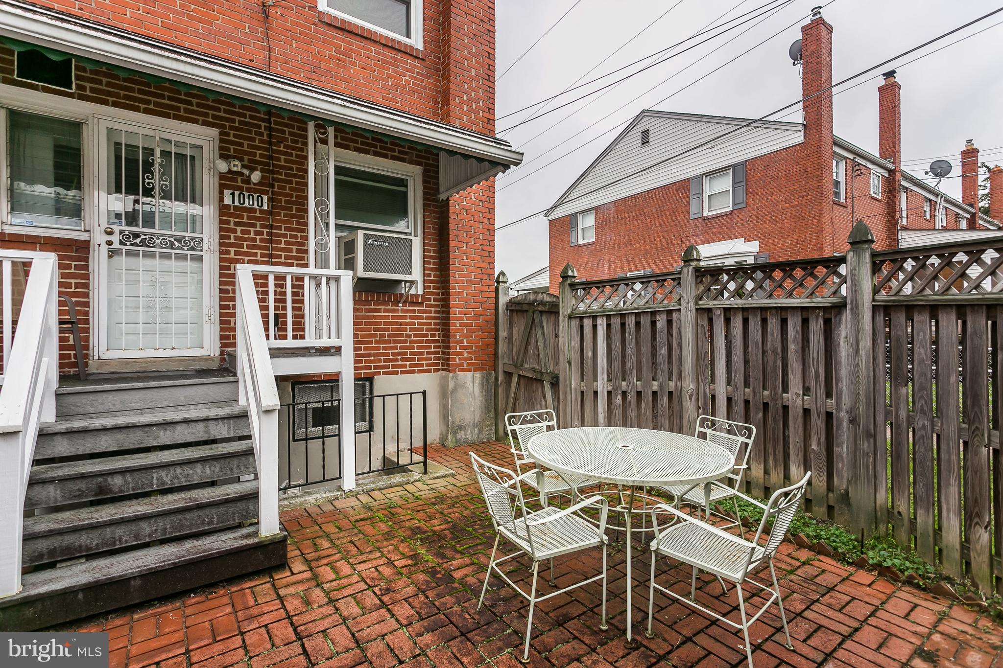 1000 Arncliffe Road Baltimore, MD 21221 - Photo 31 of 36 a view of a patio with a table and chairs