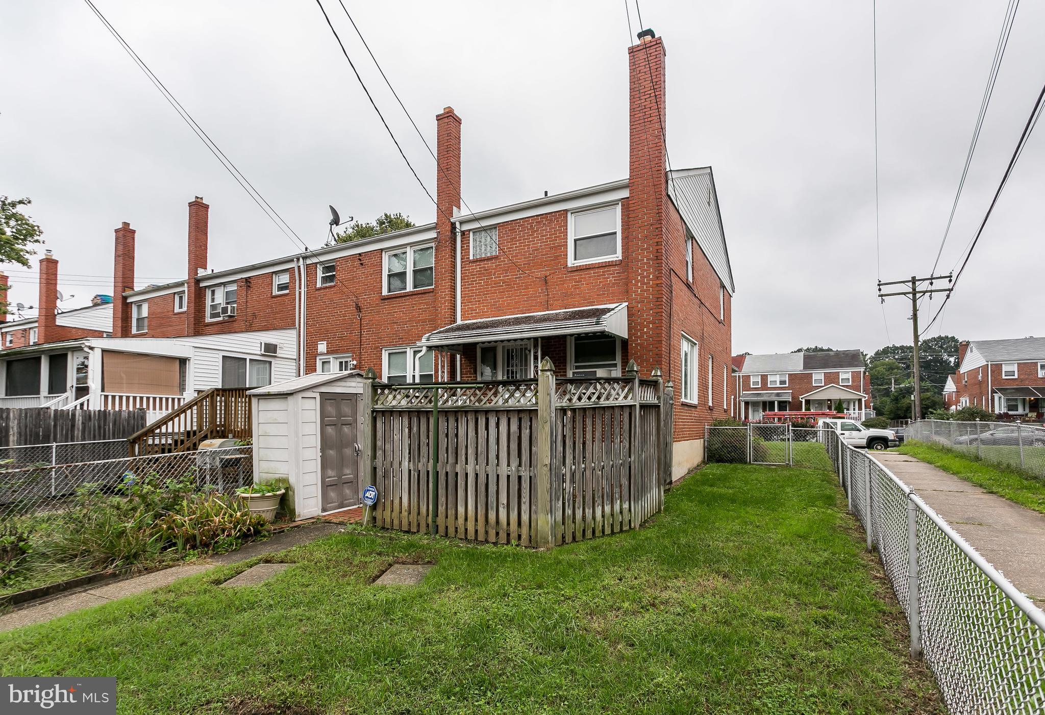 1000 Arncliffe Road Baltimore, MD 21221 - Photo 32 of 36 a view of a house with a yard and deck