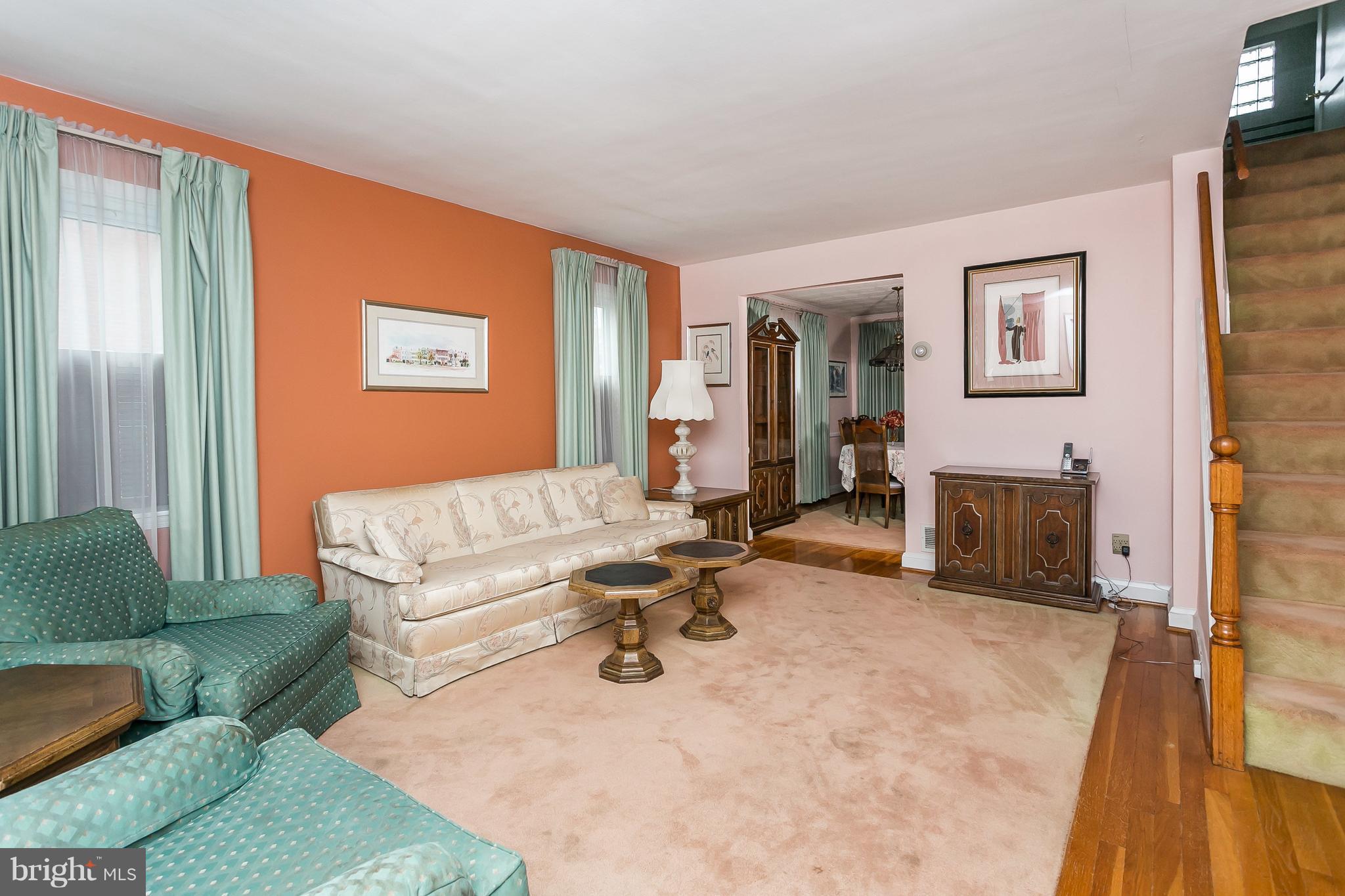1000 Arncliffe Road Baltimore, MD 21221 - Photo 5 of 36 a living room with furniture a flat screen tv and a fireplace