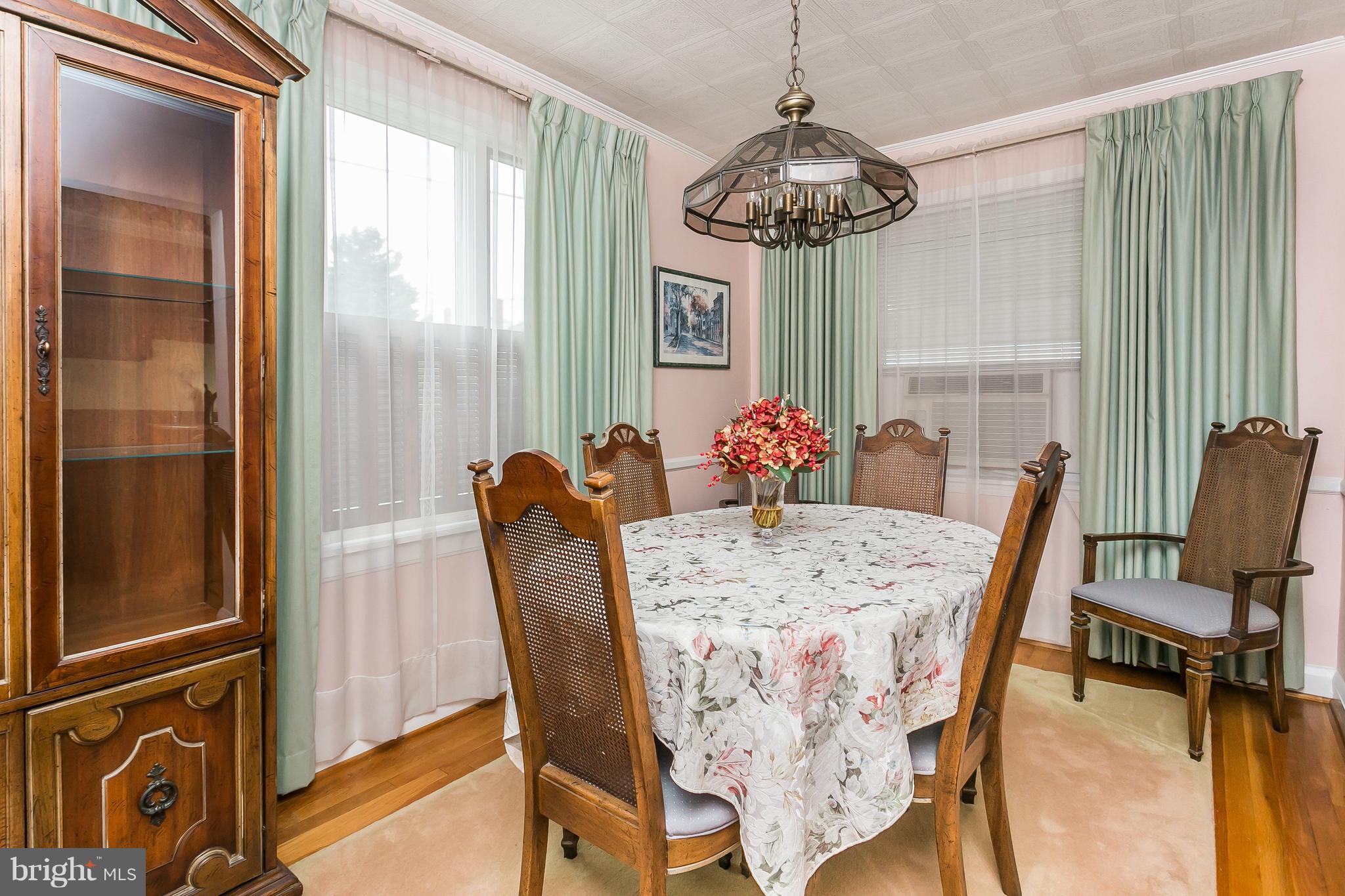 1000 Arncliffe Road Baltimore, MD 21221 - Photo 9 of 36 a view of a dining room with furniture window and wooden floor