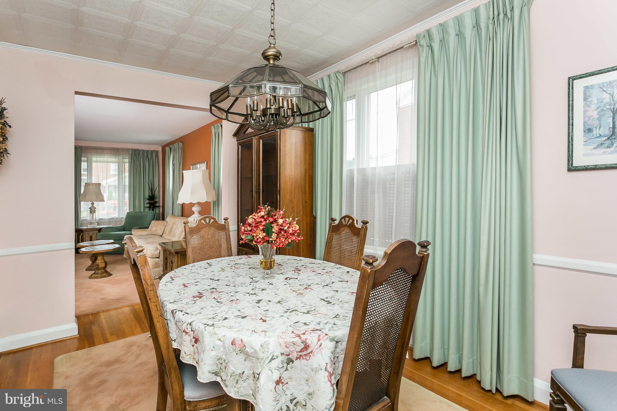 1000 Arncliffe Road Baltimore, MD 21221 - Photo 10 of 36 a view of a dining room with furniture window and wooden floor