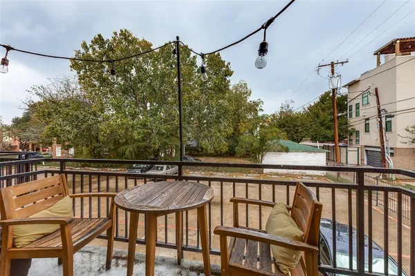 a view of a balcony with chairs