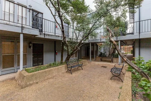 a view of a house with backyard porch and sitting area