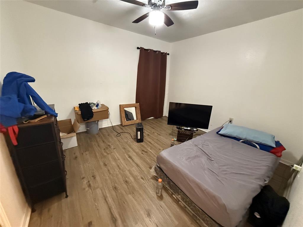 2912 Frazier Street Dallas, TX 75210 - Photo 11 of 36 a bedroom with a bed and a desk