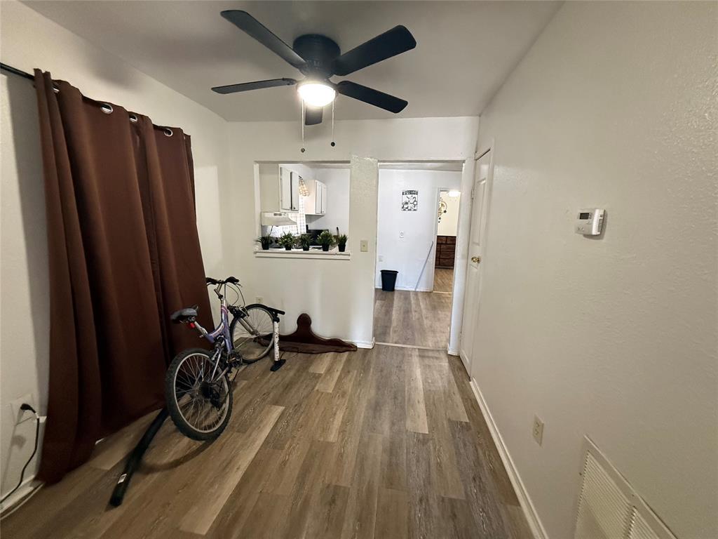 2912 Frazier Street Dallas, TX 75210 - Photo 17 of 36 a view of a hallway with wooden floor