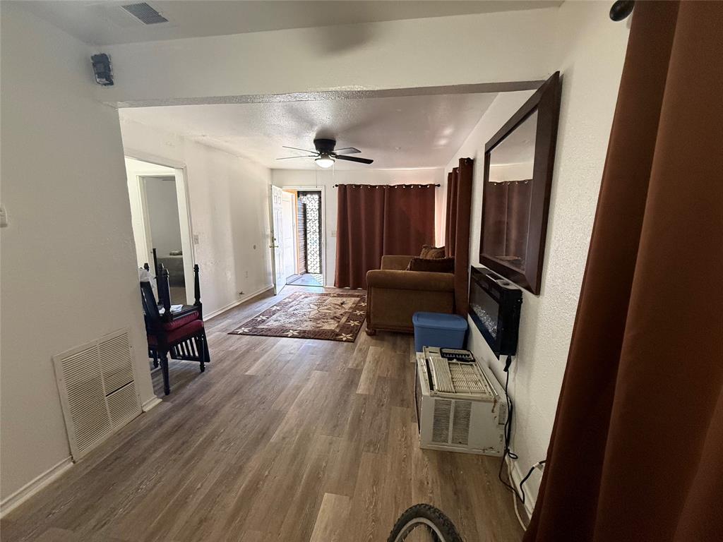 2912 Frazier Street Dallas, TX 75210 - Photo 18 of 36 a living room with furniture and a flat screen tv