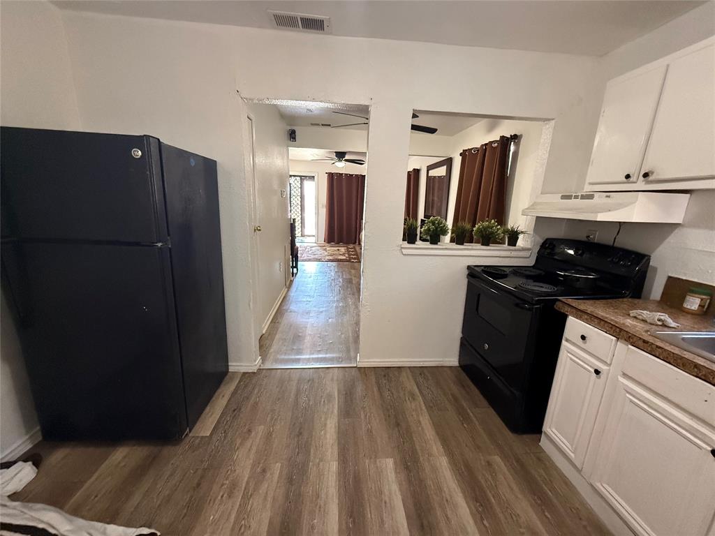 2912 Frazier Street Dallas, TX 75210 - Photo 20 of 36 a kitchen with a sink and refrigerator