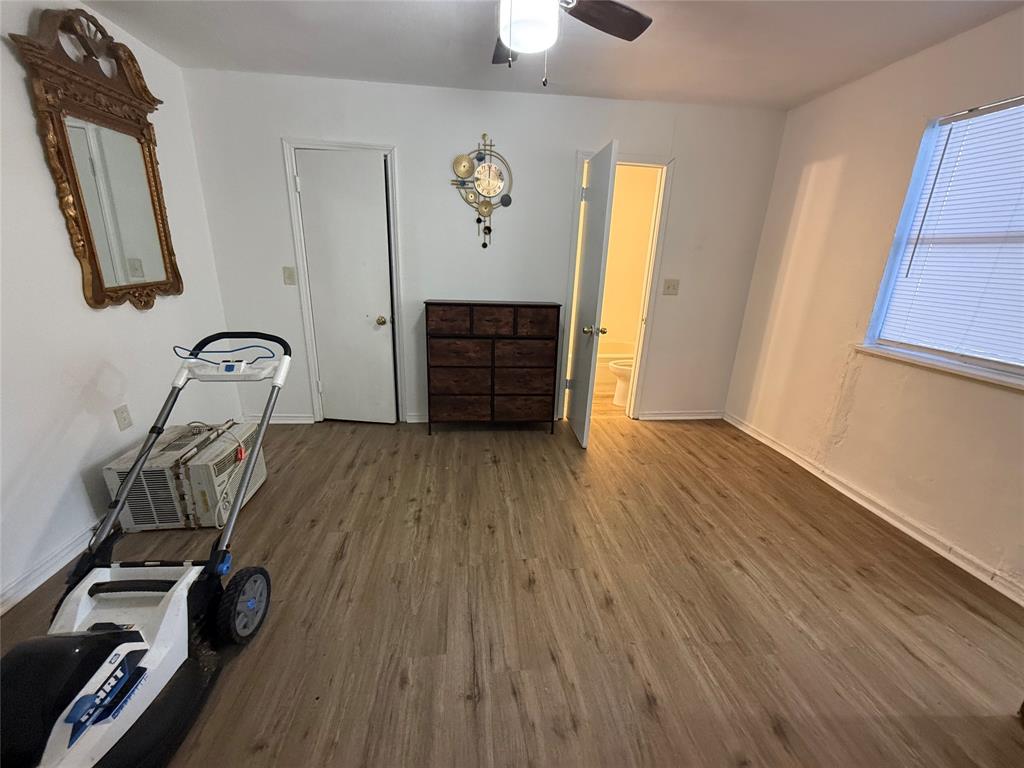 2912 Frazier Street Dallas, TX 75210 - Photo 21 of 36 a view of a room with wooden floor and closet